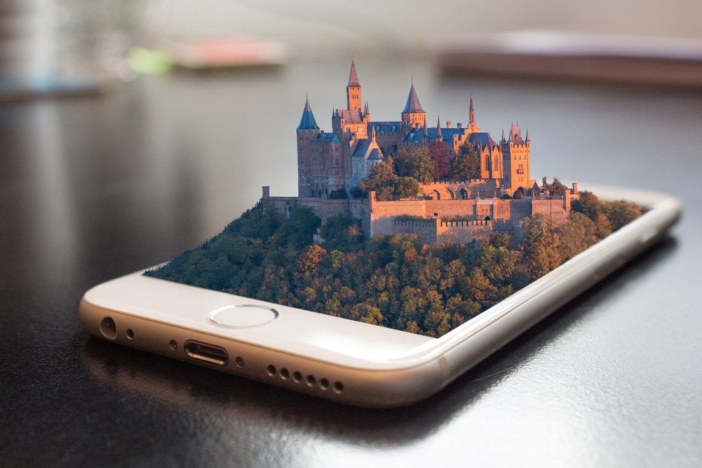 iphone with a virtual castle popping off the screen