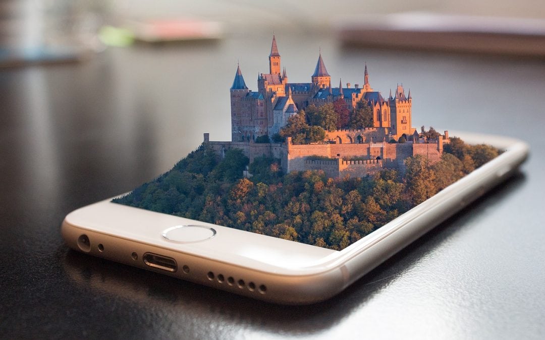 iphone with a virtual castle popping off the screen